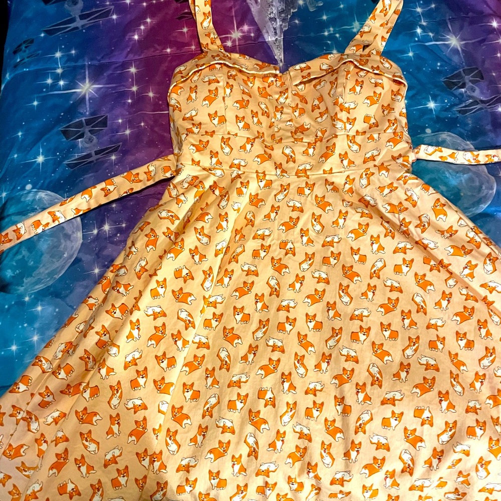 Size large runs small I wear a size 7 very cute fit and flare.